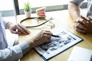 doctor and  patient reviewing an X-ray